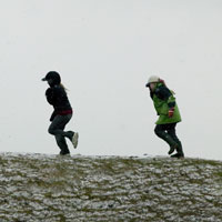 Children from Youlgrave Primary School exploring Arbor Low
