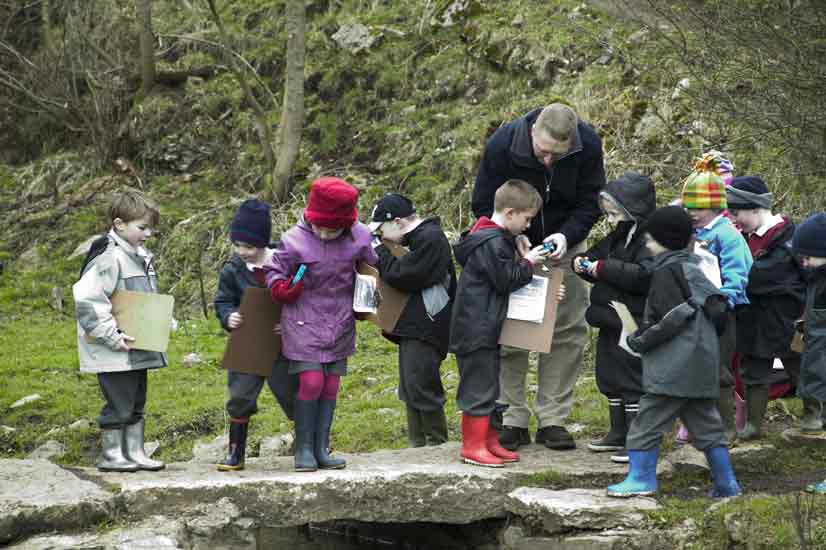 Exploring sights and sounds at the Clapper Bridge while investigating other stones in the parish